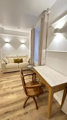 a living room with a table and a couch at Se Urban Suite 22 in Funchal