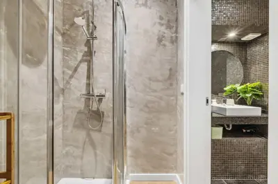 a shower with a glass door in a bathroom at Funchal Tropical - Filodendro by Homie in Funchal