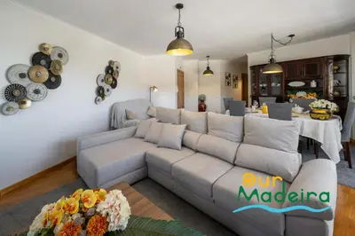 a living room with a couch and a table at OurMadeira - Alamos UpTown in Funchal