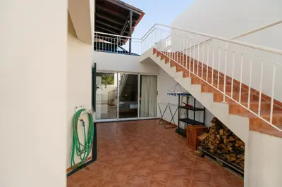 a view of the hallway of a house with a staircase at Sunrise House by Wanderlust Madeira - 2 Bedroom Sea View in Gaula