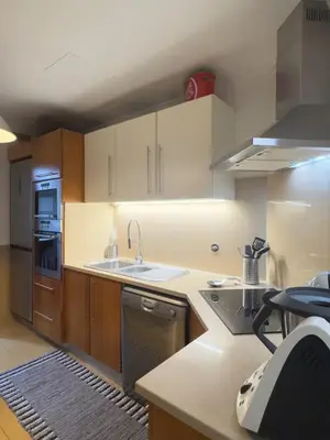 a kitchen with a sink and a dishwasher at Cantinho da Flor in Relógio do Poiso