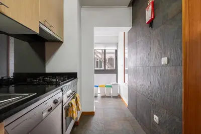 a kitchen with a sink and a stove top oven at Urban Stay 1B by Homie in Funchal