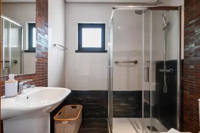 a bathroom with a sink and a shower at Urban Stay 1B by Homie in Funchal