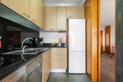 a kitchen with a sink and a refrigerator at Urban Stay 1A by Homie in Funchal