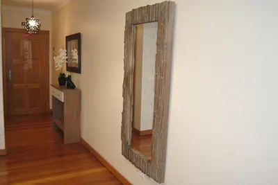 a large mirror on a wall in a room at Aurora Park com piscina in Funchal