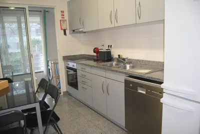 a kitchen with a sink and a counter top at Aurora Park com piscina in Funchal