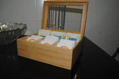 a wooden box with food in it with a mirror at Aurora Park com piscina in Funchal