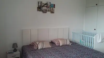 a bedroom with a bed with two pillows on it at Vista Funchal in Funchal