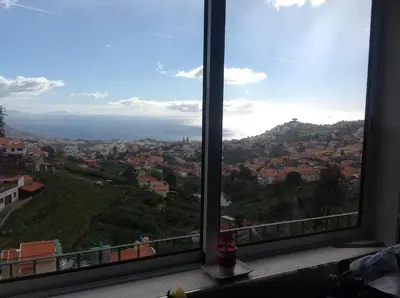 a view of a city from a window at Vista Funchal in Funchal