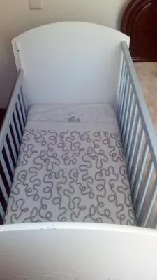 a white crib with a mattress in a room at Vista Funchal in Funchal