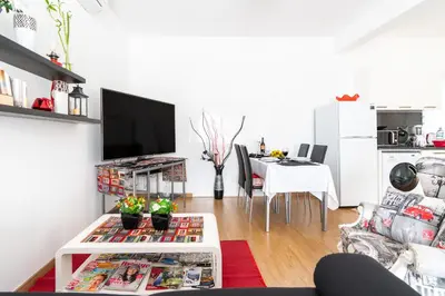 a living room with a couch and a table at Casa Annie in Arco da Calheta