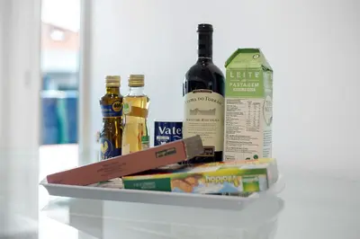 a box with bottles of wine and food on a counter at Macedo Penthouse in Funchal