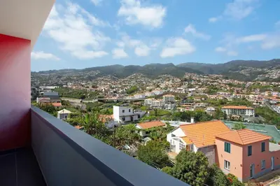 a view of a city from a balcony at Macedo Penthouse in Funchal