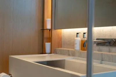 a bathroom with a white sink and a mirror at Cloud9 by LovelyStay in Funchal
