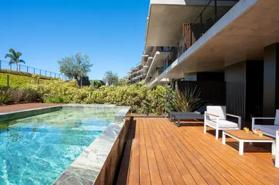 a swimming pool on a deck next to a building at Cloud9 by LovelyStay in Funchal