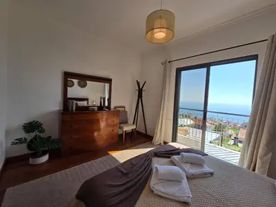 a view of the ocean from the balcony of a condo at Villa Izilda by ESCAPE to Madeira in Ponta do Sol