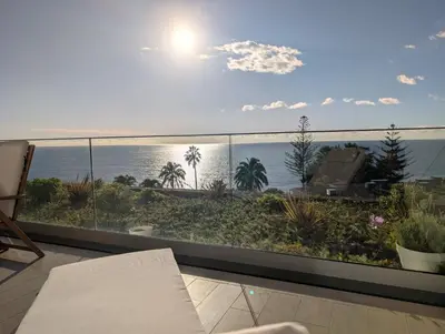 a balcony with a view of the ocean at Breathtaking Oceanfront Living, Sunset Facing 3-Bedroom Flat in Acqua Residences in Funchal