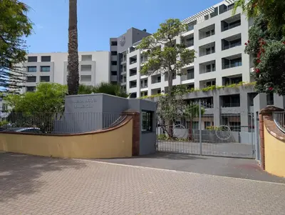 a fence in front of a building in a city at Breathtaking Oceanfront Living, Sunset Facing 3-Bedroom Flat in Acqua Residences in Funchal