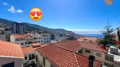 a frisbee in the air over a city at Great Stay 1 Bedroom Funchal Central Duplex Retreat in Funchal