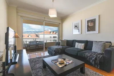 a living room with a couch and a table at Sunny Stay Green Park by Atlantic Holiday in Panasqueira