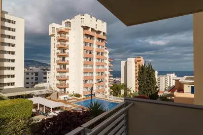 a view from the balcony of a building with a pool at GuestReady – Scenic Stay in the Heart of Funchal in Funchal