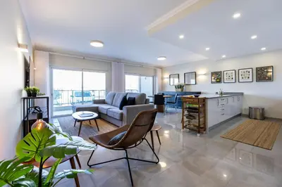 a living room with a couch and a table at Boa Vista - Salo Apartment in Lagos