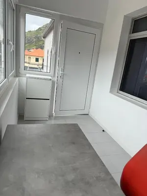 a white room with two windows and a tiled floor at Sunrise Valley in Machico