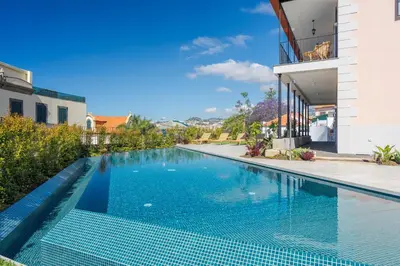 an image of a swimming pool in a house at Luxury Quinta Rosa by Holiday Rental Madeira in Funchal