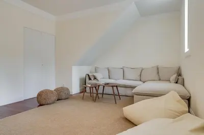 a living room with a couch and a table at Luxury Quinta Rosa by Holiday Rental Madeira in Funchal