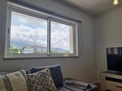 a window in a room with a couch and a television at Julianas Place by Susys Holidays in Funchal