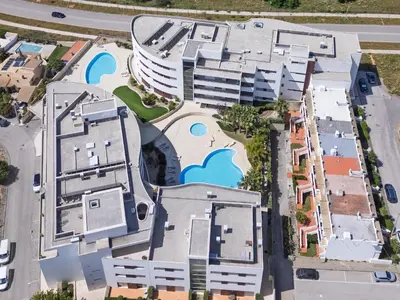 an overhead view of a building with a swimming pool at Beach Condominium 28 by Destination Algarve in Atalaia