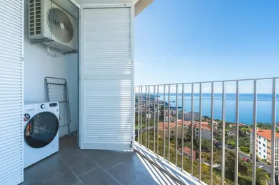 a balcony with a view of the ocean at Atlantic View Apartment by Atlantic Holiday in Câmara de Lobos
