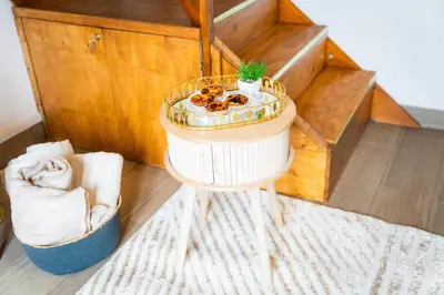 a small table with a potted plant on top of it at Whale's Lodge in Porto Moniz