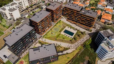an overhead view of a city with tall buildings at Horizon Funchal in Funchal