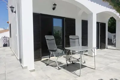 two chairs and a table on a patio at Endless Ocean - Praia da Luz in Luz