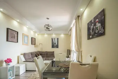 a living room with a table and a couch at America Apartment by Holiday Rental Madeira in Funchal