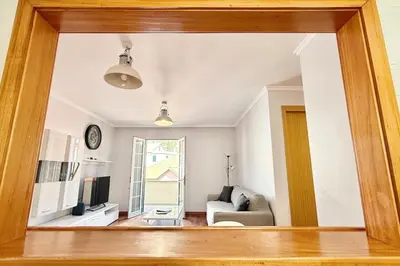 a view of a living room through a mirror at Serena Bay in Câmara de Lobos