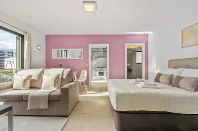 a living room with a bed and a couch at Forum Garden View 5A by Homie in Funchal