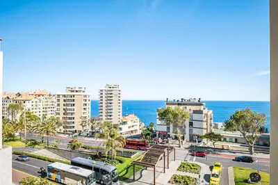 a view of a city with the ocean in the background at Forum Ocean View 5C by Homie in Funchal