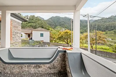 a bath tub on the balcony of a house at Villa Pomar, By OP in Senhora do Rosário