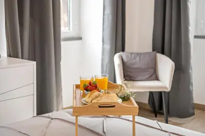 a tray of food and two glasses of orange juice at Villa Pomar, By OP in Senhora do Rosário