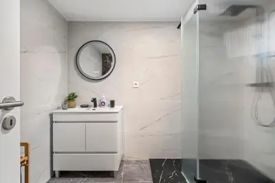 a white bathroom with a sink and a mirror at Villa Pomar, By OP in Senhora do Rosário
