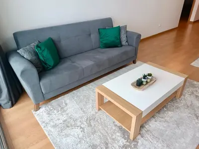 a living room with a couch and a coffee table at Prestige Solmar - Sea View Apartment - Free covered parking - Caniço Center in Caniço