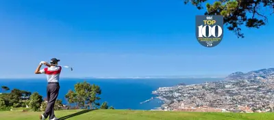 a man swinging a golf club on top of a hill at Prestige Solmar - Sea View Apartment - Free covered parking - Caniço Center in Caniço