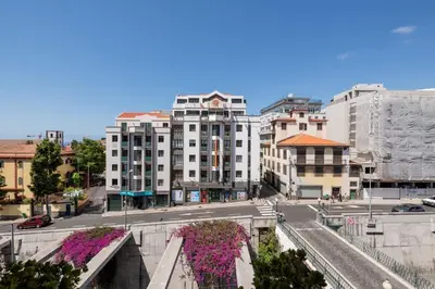 a view of a city street with tall buildings at Yellow Sun Studio - Cozy Stay in Central Funchal in Funchal