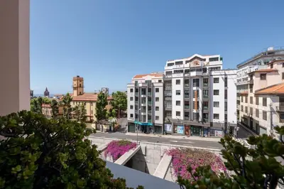 a view of a city street with tall buildings at Yellow Sun Studio - Cozy Stay in Central Funchal in Funchal