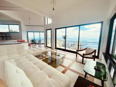 a large living room with a lot of windows at TheView in Funchal