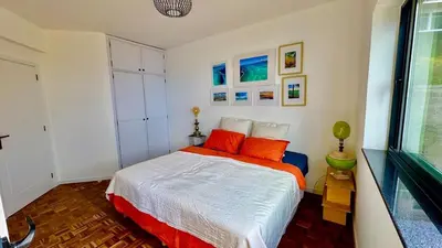 a bedroom with a bed and a large window at TheView in Funchal