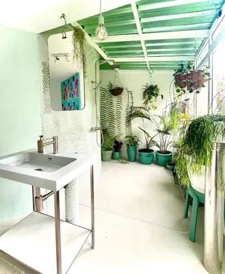 a room with potted plants on the walls at TheView in Funchal