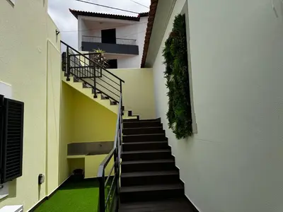 a stairway in a building with a green floor at São Pedro Paradise B Down in Funchal